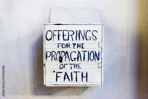 Charity collection box for the "propagation of the faith" for missionaries inside an Irish church