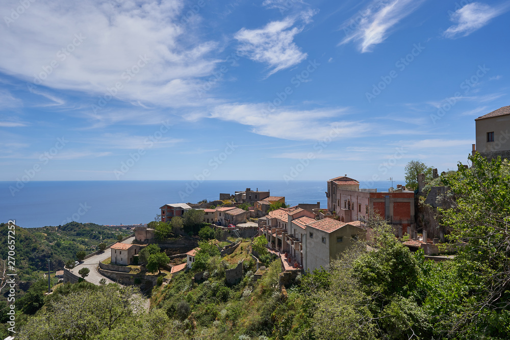 Landscape picture of town Savoca which is a municipality in the Province of Messina in the Italian region Sicily. Beautiful historic town from middle ages, houses made from stone with terracotta roofs