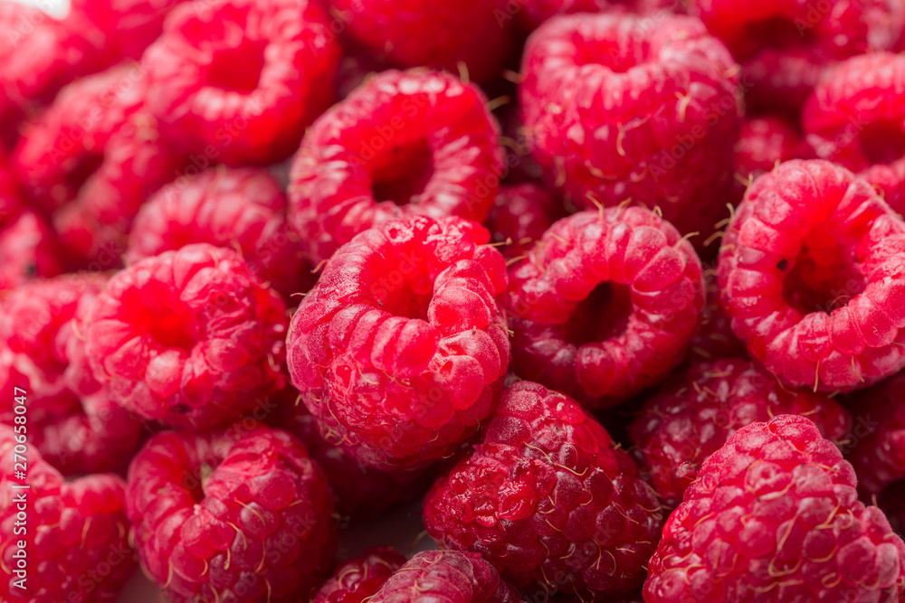 Fresh and sweet raspberries background