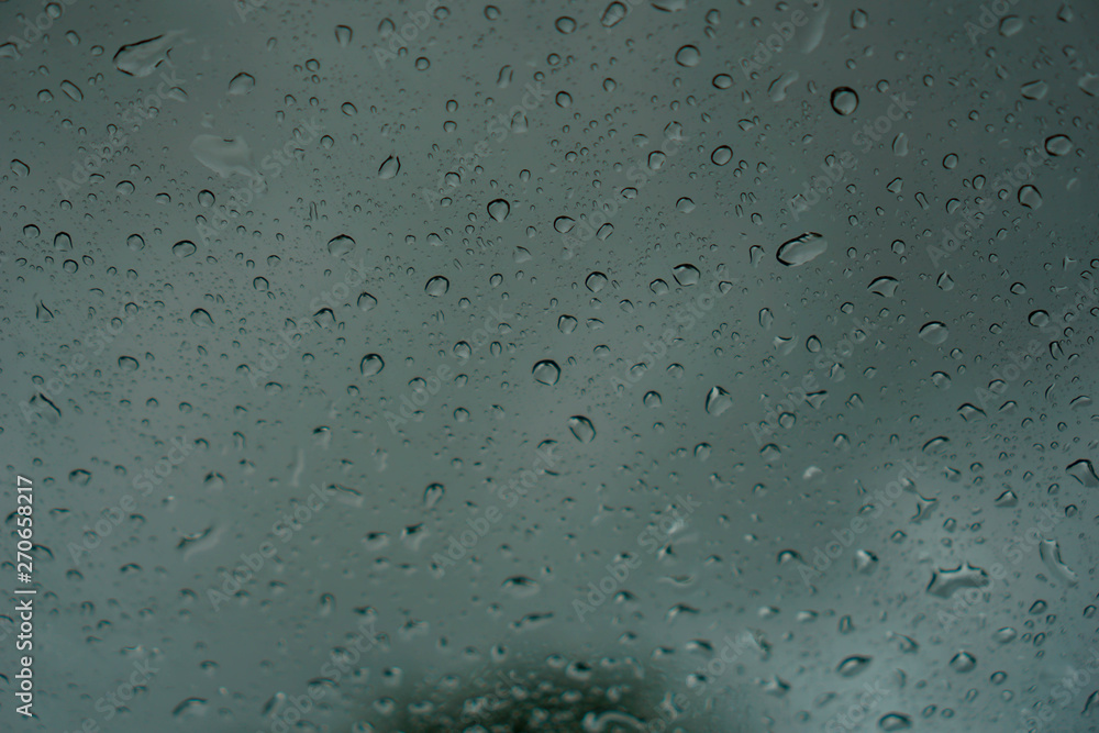 blur backgruond,Rain water on the car glass. blur backgruond,Rain water on the car glass.