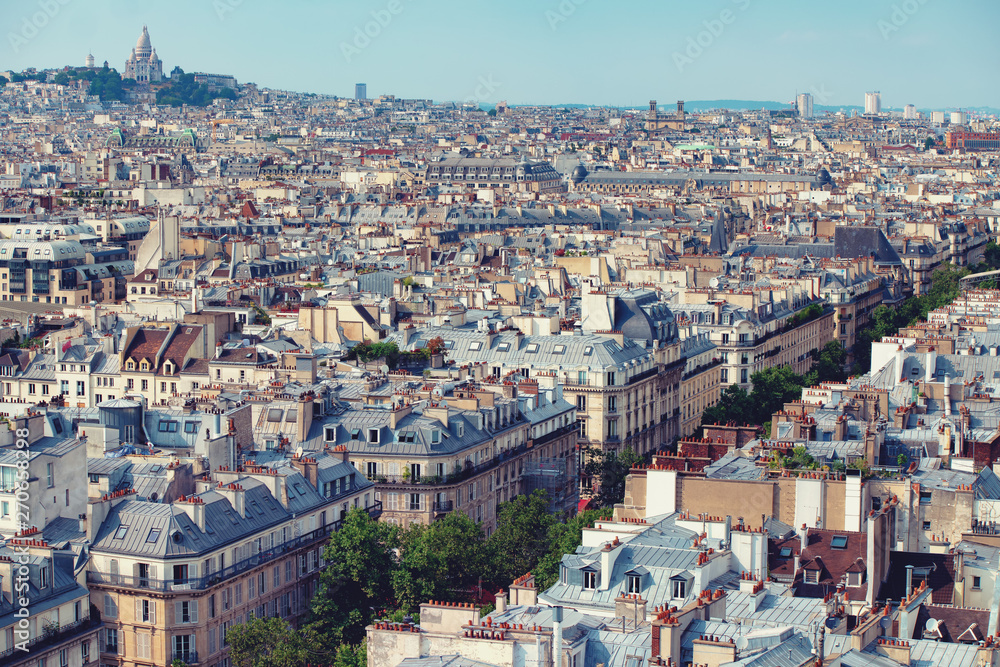 Sacré-Cœur with rooftops of parisian homes in front