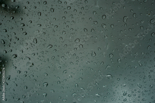 blur backgruond,Rain water on the car glass.
