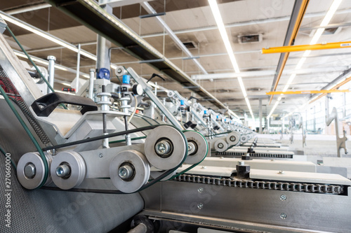 Photography Folding Machine Output Hopper Stacks Wheels Closeup Industrial Machine Printing