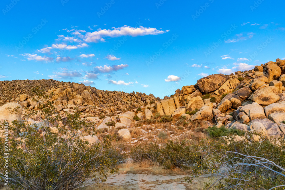 Large boulders on a hill during sunset lighting