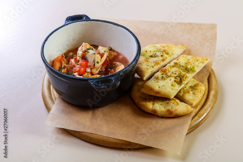 Seafood suop with bread photo