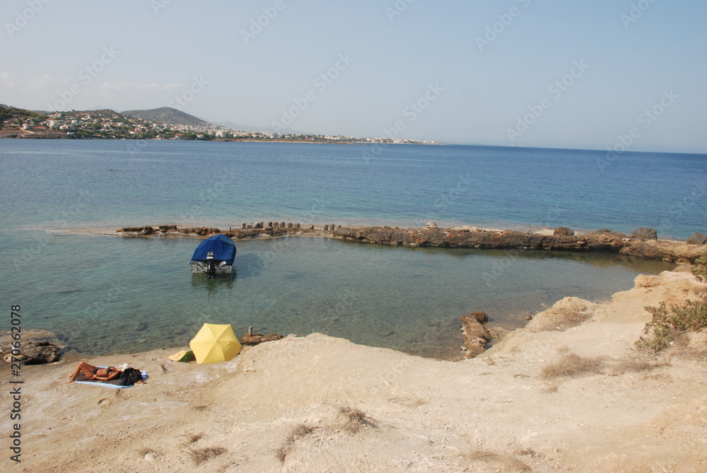 Calm seas and sunny skies at the Hamolia beach near the city of Athens. Vravrona region, Attica, Greece. Calm seas and sunny skies at the Hamolia beach near the city of Athens. Vravrona region, Attica, Greece.