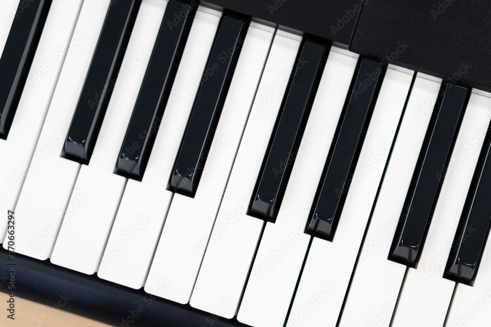 Midi keyboard piano on wooden table, creative home studio entertainment equipment background, synthesizer key Midi keyboard piano on wooden table, creative home studio entertainment equipment background, synthesizer key