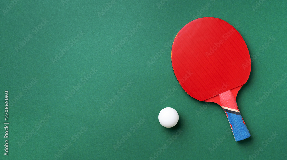 Sport, fitness, healthy lifestyle concept. Ping-pong or table tennis rackets and white ball on green background. Top view. Flat lay. Sport, fitness, healthy lifestyle concept. Ping-pong or table tennis rackets and white ball on green background. Top view. Flat lay.