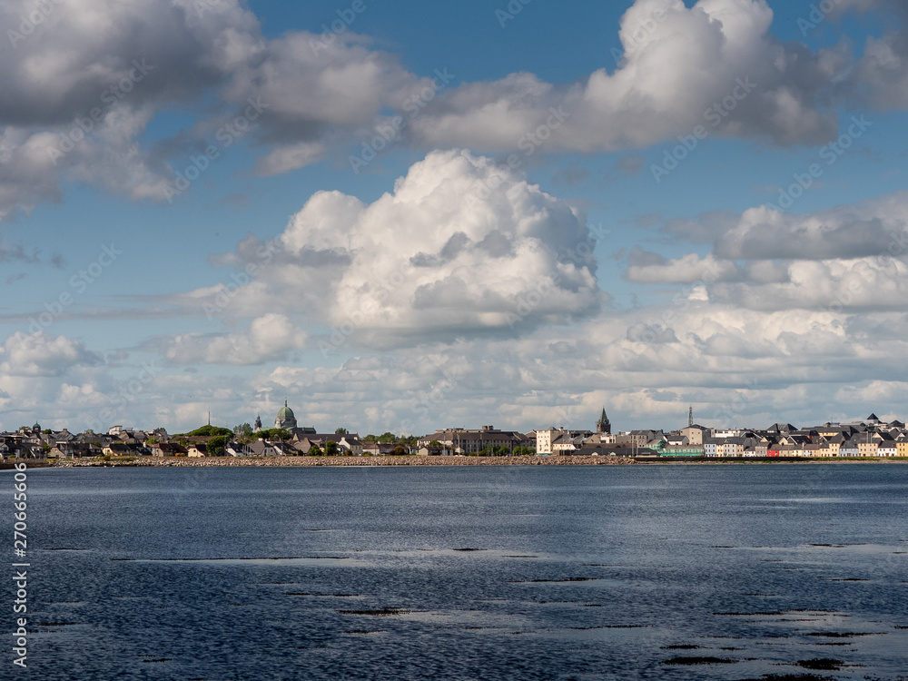 Clouds over Galway city Ireland, Atlantic ocean, Claddagh area, Galway Cathedral dome.