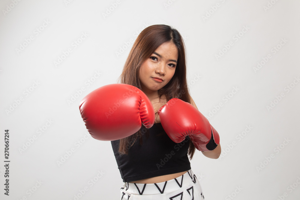 Young Asian woman with red boxing gloves. Young Asian woman with red boxing gloves.