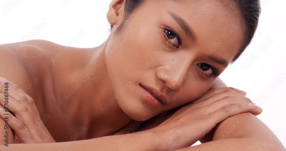 Beautiful asian woman with perfect skin at white background. People with beauty, makeup, health care concept. Beautiful asian woman with perfect skin at white background. People with beauty, makeup, health care concept.