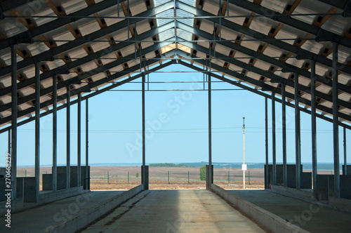 Wooden beams on steel structure for further construction. Metal frame for the installation of insulation panels. Construction of pre-fabricated buildings. #270668239
