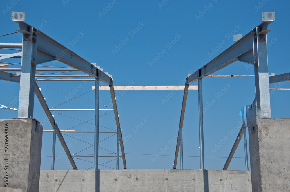 Structure of steel for building construction. The steel structure of the new building for further construction. Metal frame for the installation of insulation panels. Structure of steel for building construction. The steel structure of the new building for further construction. Metal frame for the installation of insulation panels.