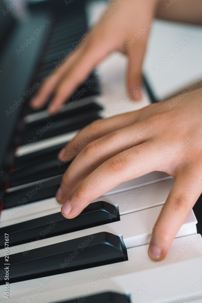 Obraz premium piano keys and playing piano