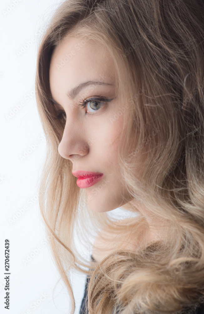 Beautiful ,young blonde with bright red lips and expressive eyes in a black jumpsuit. Beauty portrait of a girl. Emotional and bright appearance. Fashion portrait of a woman. Beautiful ,young blonde with bright red lips and expressive eyes in a black jumpsuit. Beauty portrait of a girl. Emotional and bright appearance. Fashion portrait of a woman.