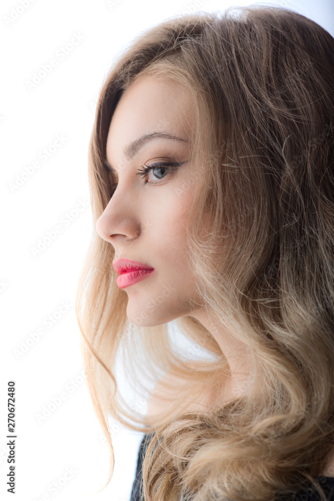Beautiful ,young blonde with bright red lips and expressive eyes in a black jumpsuit. Beauty portrait of a girl. Emotional and bright appearance. Fashion portrait of a woman. Beautiful ,young blonde with bright red lips and expressive eyes in a black jumpsuit. Beauty portrait of a girl. Emotional and bright appearance. Fashion portrait of a woman.