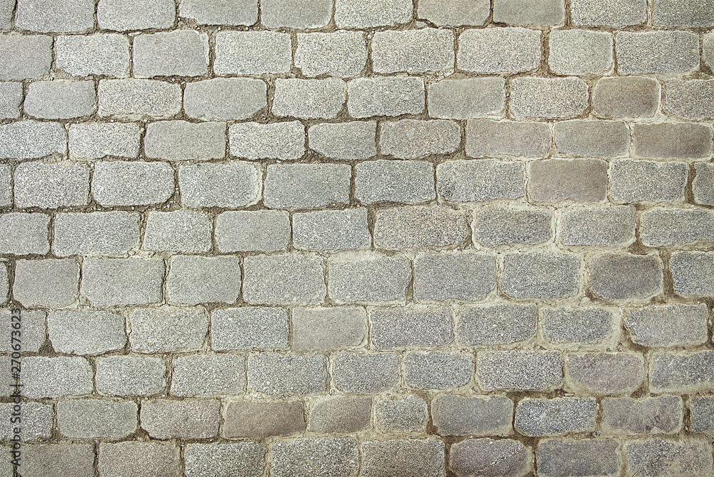 Obraz premium Old grey stone pavement background texture