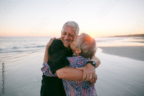 Happy couple holding each other photo