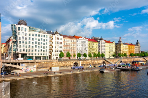 Dancing house and Masarykova embankment in Prague, Czech Republic photo