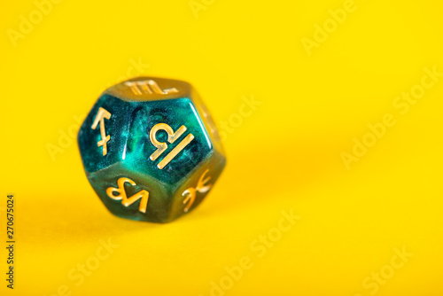 Astrology Dice with zodiac symbol of Libra Sep 23 - Oct 22 on Yellow Background photo