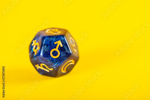 Astrology Dice with symbol of the planet Mars on Yellow Background