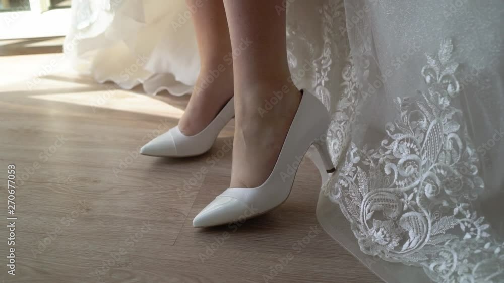Bride put on her shoes Bride put on her shoes