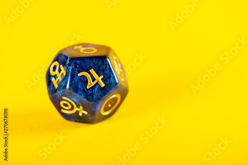 Astrology Dice with symbol of the planet Jupiter on Yellow Background