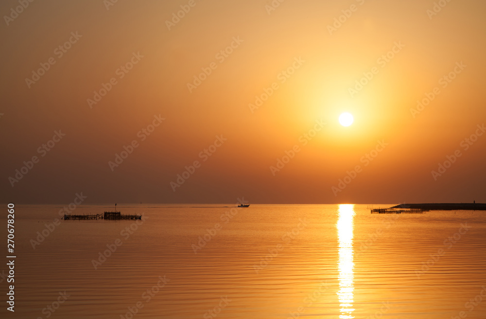 Sunrise at Asker beach with beautiful reflection on water