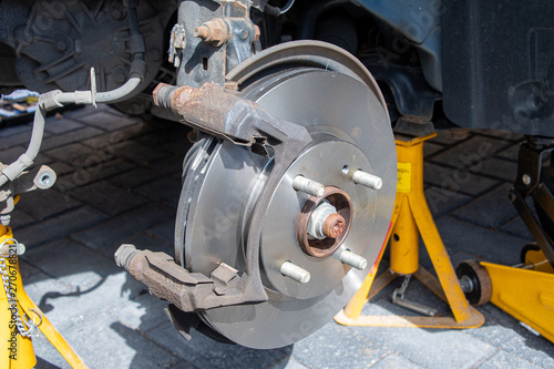 New brake disk fitted to a car wheel