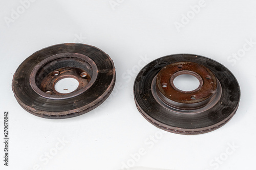 Front and back view of old rusty brake discs