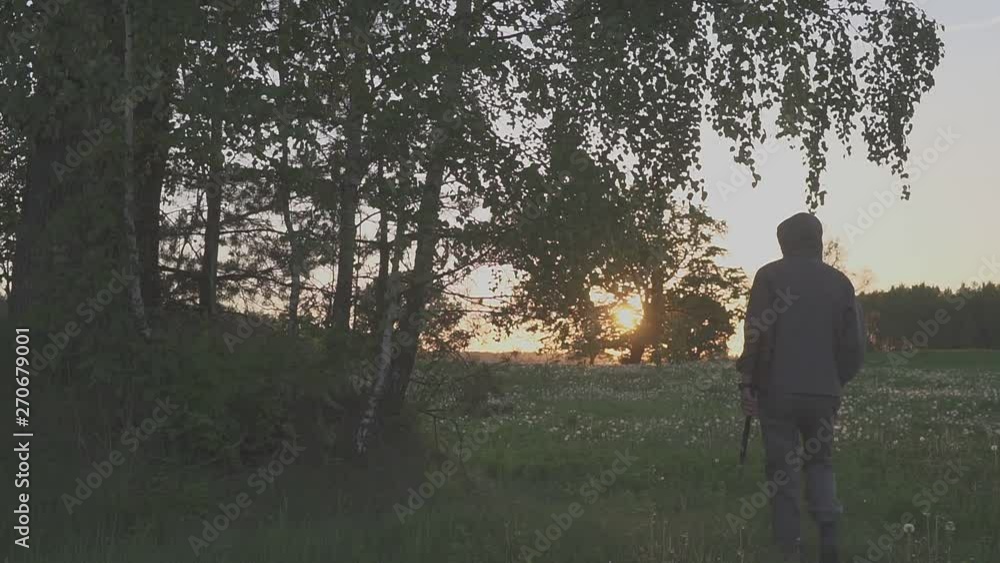 Strong woodcutter chopping wood in the forest. sunset Strong woodcutter chopping wood in the forest. sunset