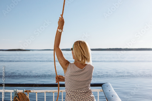 Woman Enjoying Summertime on Cruise ship photo