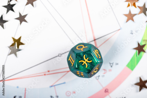 Astrology Dice with zodiac symbol of Pisces Feb 19 - Mar 20 on Natal Chart Background photo