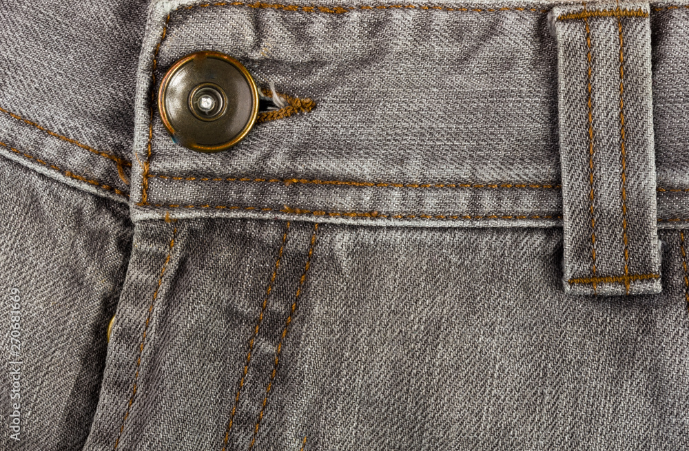 clothing items stonewashed cotton fabric texture with seams, clasps, buttons and rivets, macro clothing items stonewashed cotton fabric texture with seams, clasps, buttons and rivets, macro