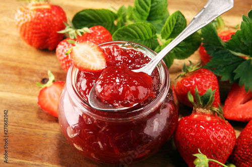 Wallpaper Mural strawberry jam with fresh strawberries and mint. marmalade on spoon and jar on brown wood Torontodigital.ca