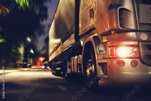 Truck at night road in selective focus photo