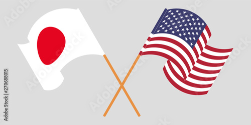 Crossed and waving flags of USA and Japan