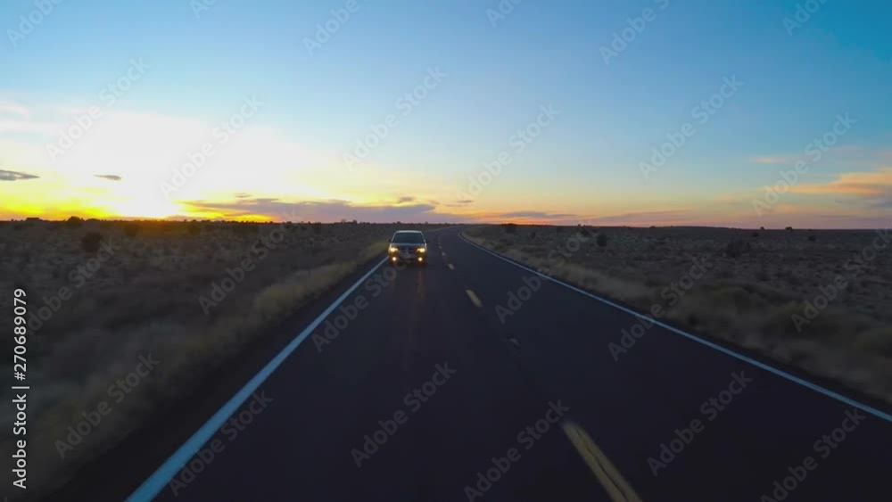 Car Traveling Rural Arizona Highway 180 At Dusk Car Traveling Rural Arizona Highway 180 At Dusk