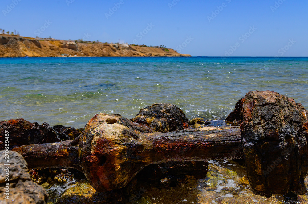 Fototapeta premium remains of an old car at sea