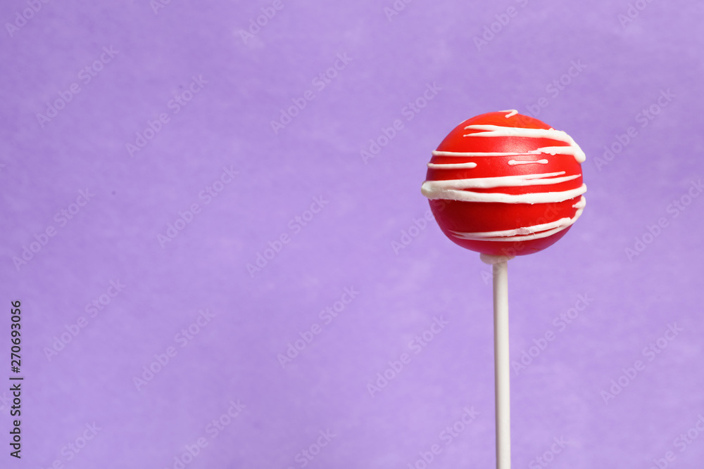 Bright delicious cake pop on color background. Space for text Bright delicious cake pop on color background. Space for text