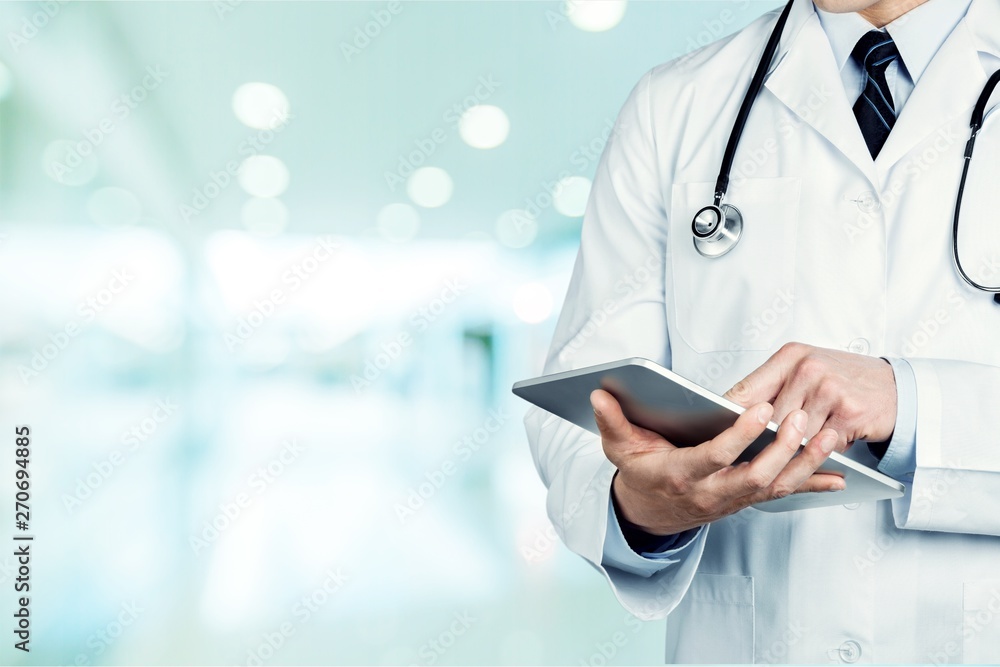 Close-up Doctor at hospital working with tablet pc Close-up Doctor at hospital working with tablet pc