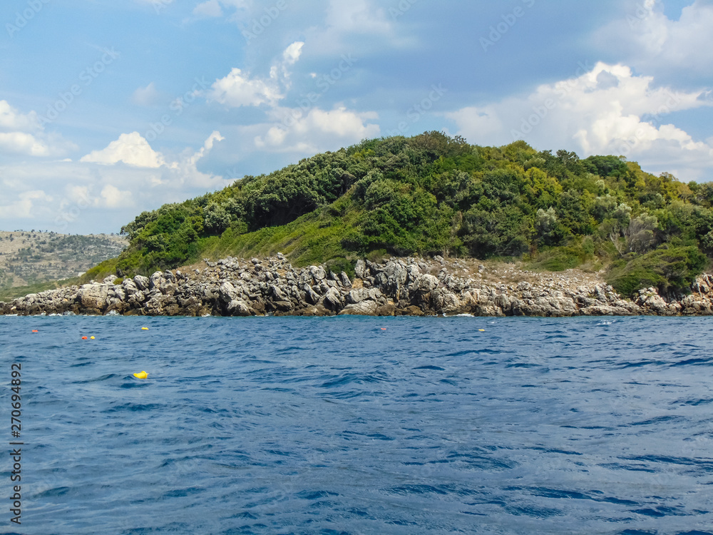 View of the rocky shore of Three island beach. View of the rocky shore of Three island beach.