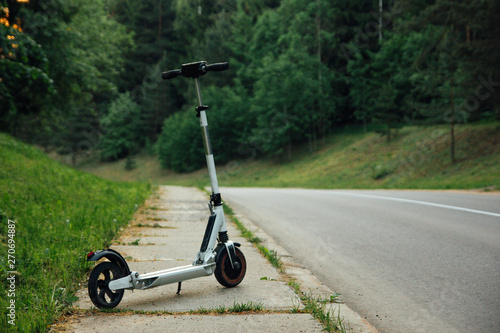 Electric scooter on asphalt bike path. ecological transport