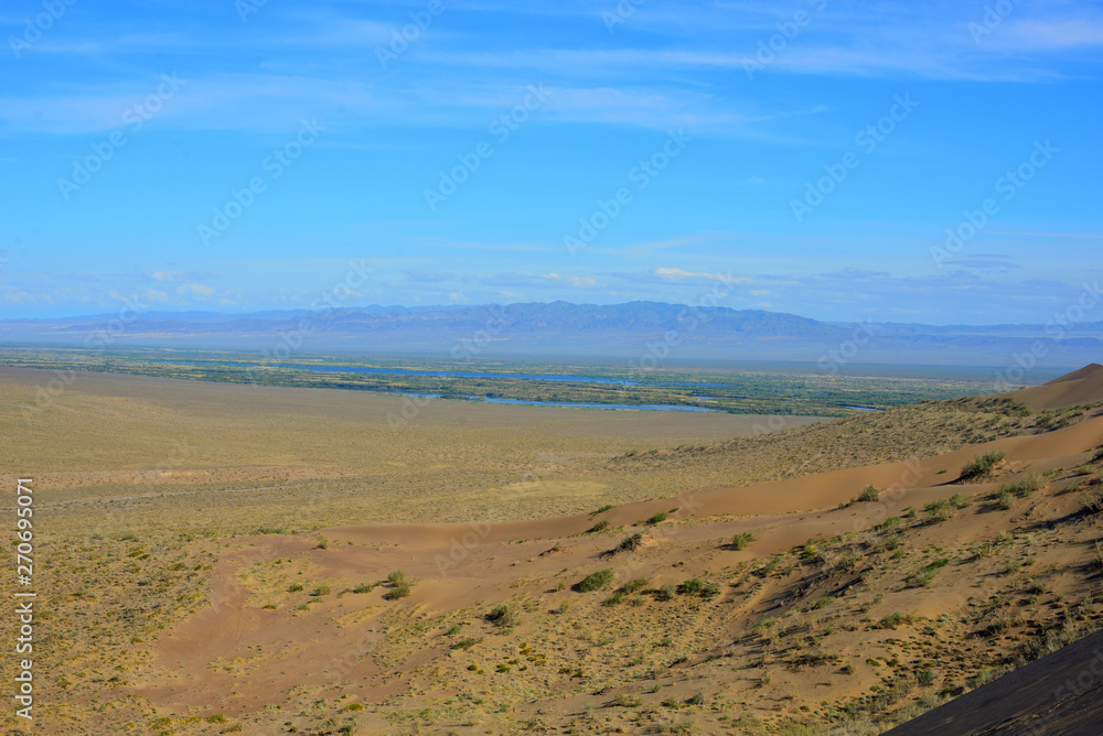 Desert landscape surrounding Singing Dune in Altyn-Emel Desert landscape surrounding Singing Dune in Altyn-Emel