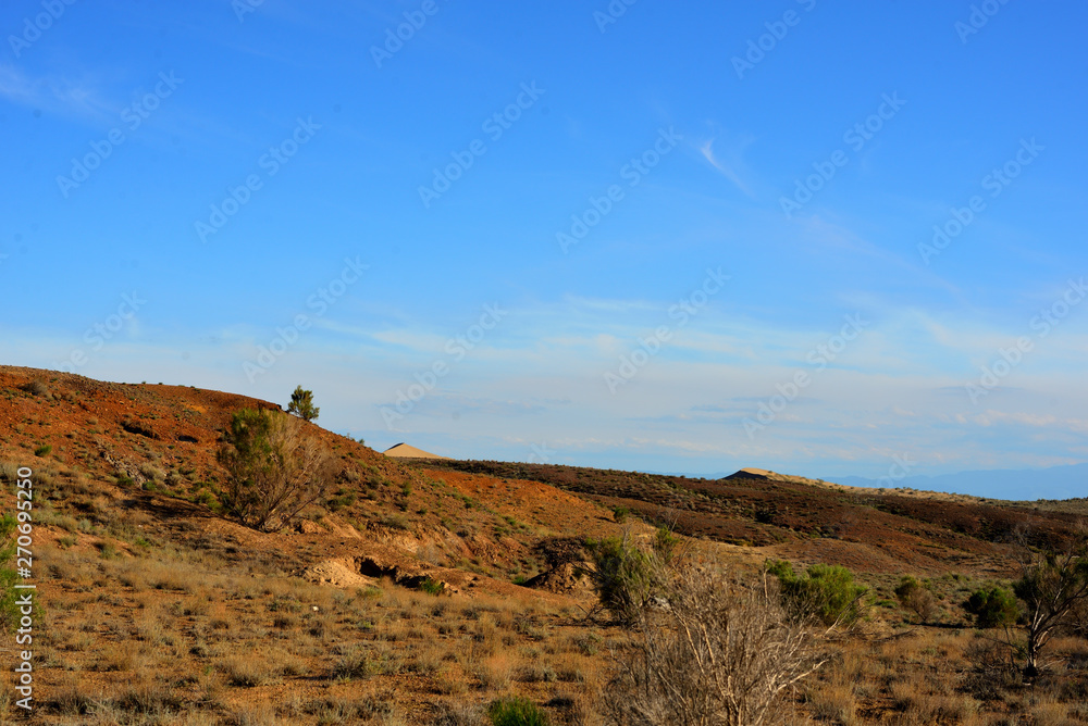 Desert landscape surrounding Singing Dune in Altyn-Emel