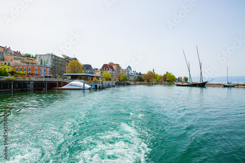 Imege of Evian-les-Bains city port in France taken from ferry boat on Lake Geneva