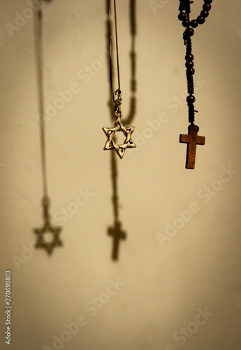 Metal star of David and wooden rosary.