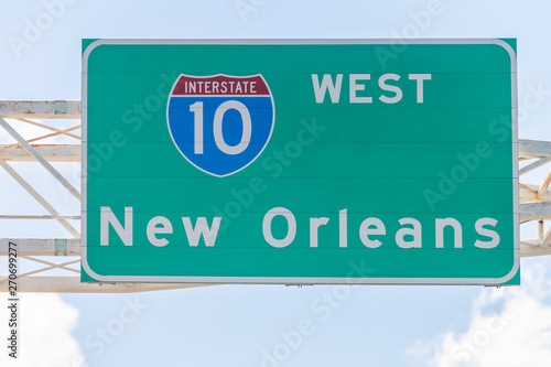 Highway road i10 west interstate 10 with direction sign and text on street for New Orleans in Lousiana