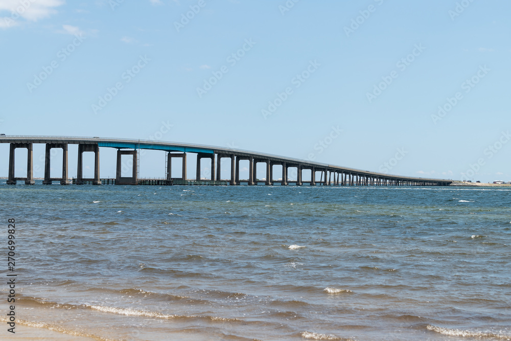 Pensacola bay bridge on US route highway road 98 with traffic cars in Navarre, Florida Panhandle over Gulf of Mexico of Emerald Coast