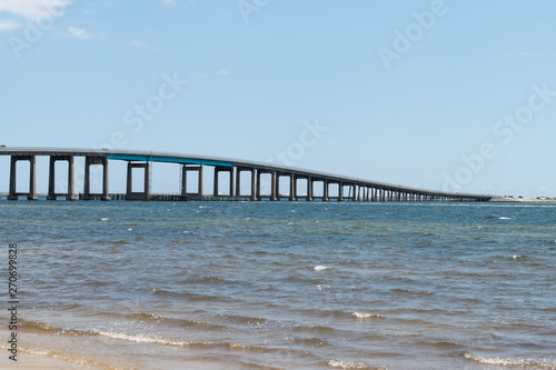 Pensacola bay bridge on US route highway road 98 with traffic cars in Navarre  Florida Panhandle over Gulf of Mexico of Emerald Coast